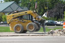 Kadlec Excavating John Deere skidloader breaking highway concrete.