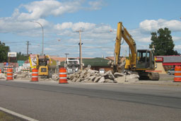Kadlec Excavating backhoe and skidloaders working on Highway 65, Mora, project in front of Hardees and Chin's Garden.