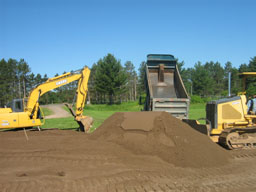 Kadlec Excavating equipment at sewer install.