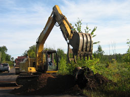 Kadlec Excavating removes swamp mud from around old culvert.