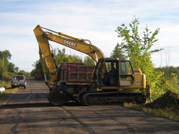 Kadlec Excavating road work with backhoe.